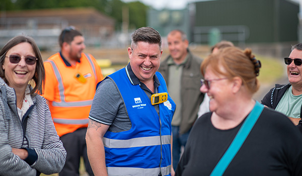 Staff with customers at the Around the Bend tours