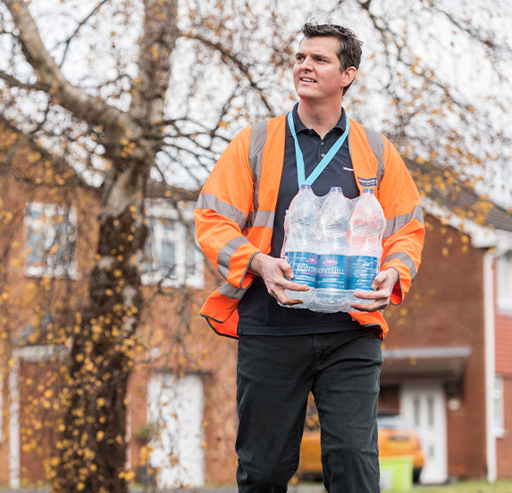 Employee delivering water