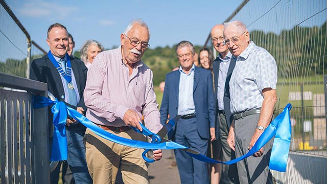 Bitton Parish Council member, Cllr Kim Scudamore, cuts the ribbon on the Bitton side of the new footway during last week's ceremony